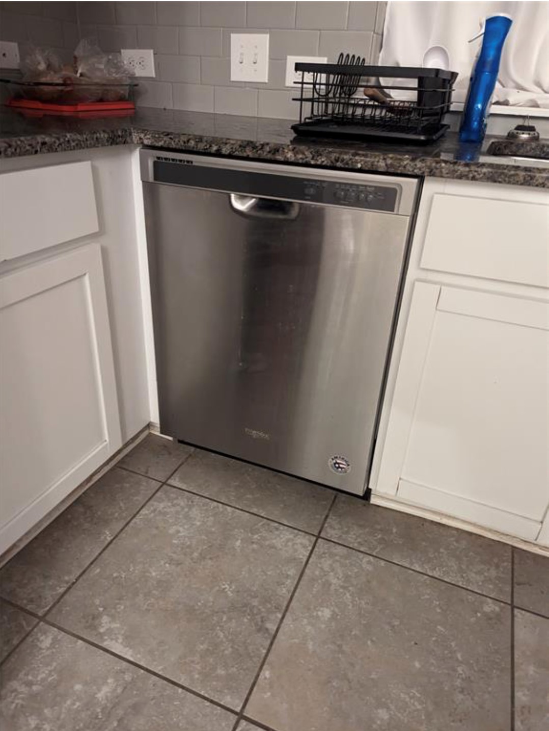 304 Cane River Road Pflugerville, TX 78660 - Photo 8 of 31 A well-appointed kitchen showcasing a sleek stainless steel dishwasher and durable tile flooring.