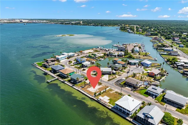 an aerial view of residential building with outdoor space and boats