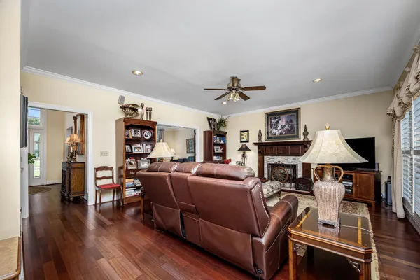 a kitchen with stainless steel appliances kitchen island granite countertop a sink a stove and a refrigerator