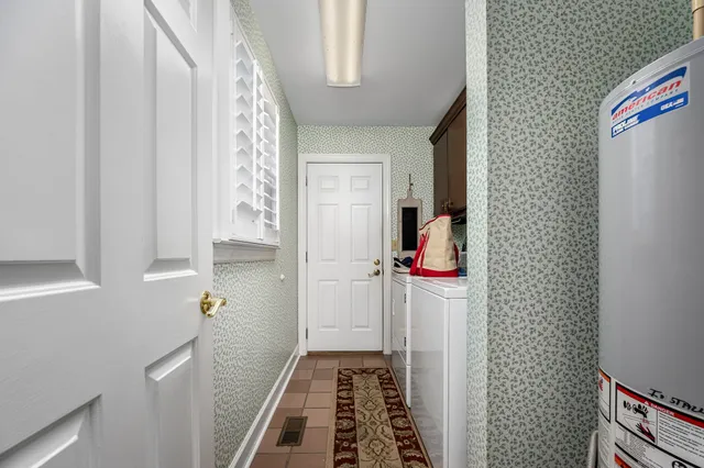 a bedroom with a bed and glass window