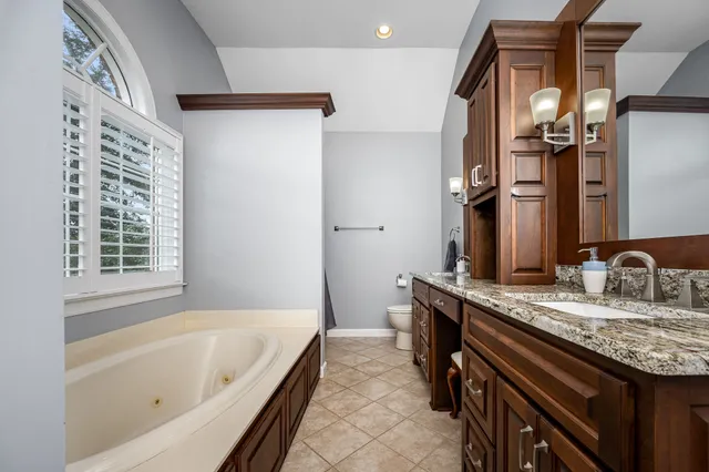 an outdoor space with pool and furniture