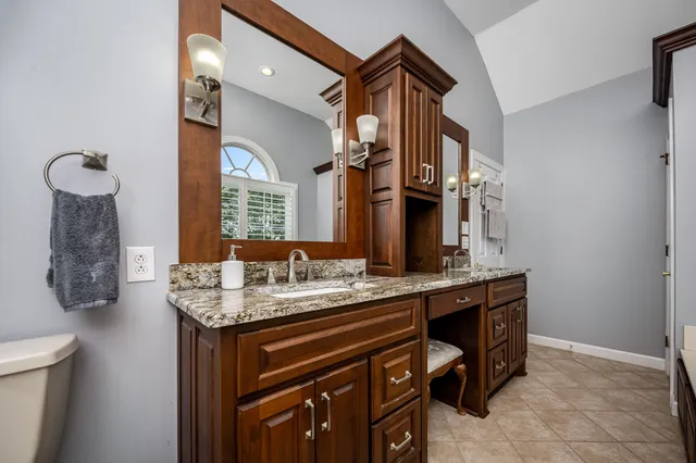 a view of patio with a table and chairs under an umbrella