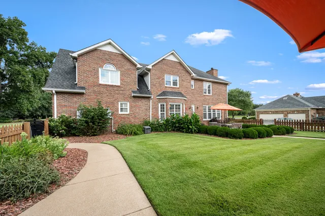 an aerial view of a house with a garden