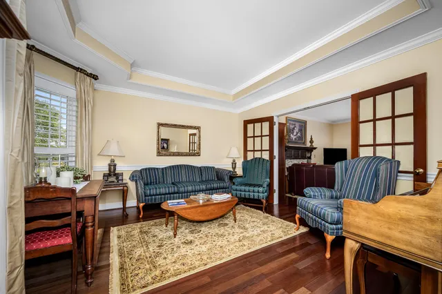 a living room with furniture or couch and a bookshelf