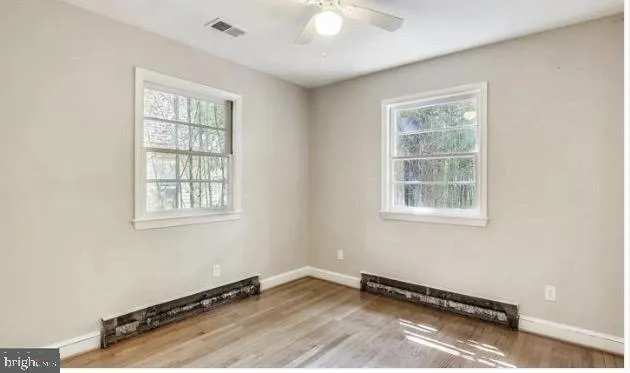 a view of a room with windows