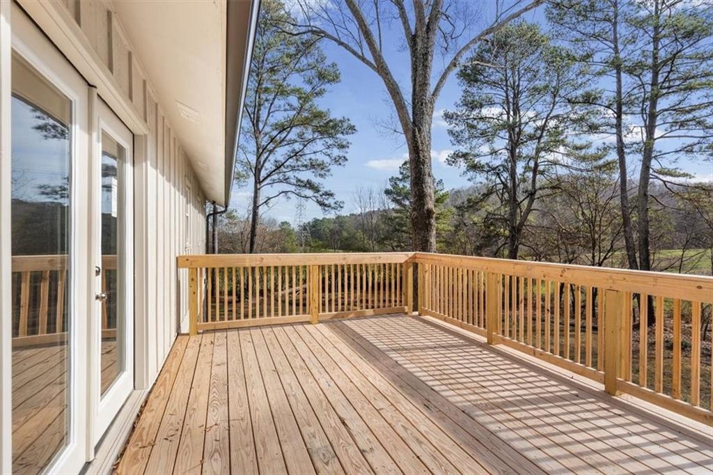 49 Apache Trail Cartersville, GA 30120 - Photo 42 of 52 a balcony with wooden floor and fence