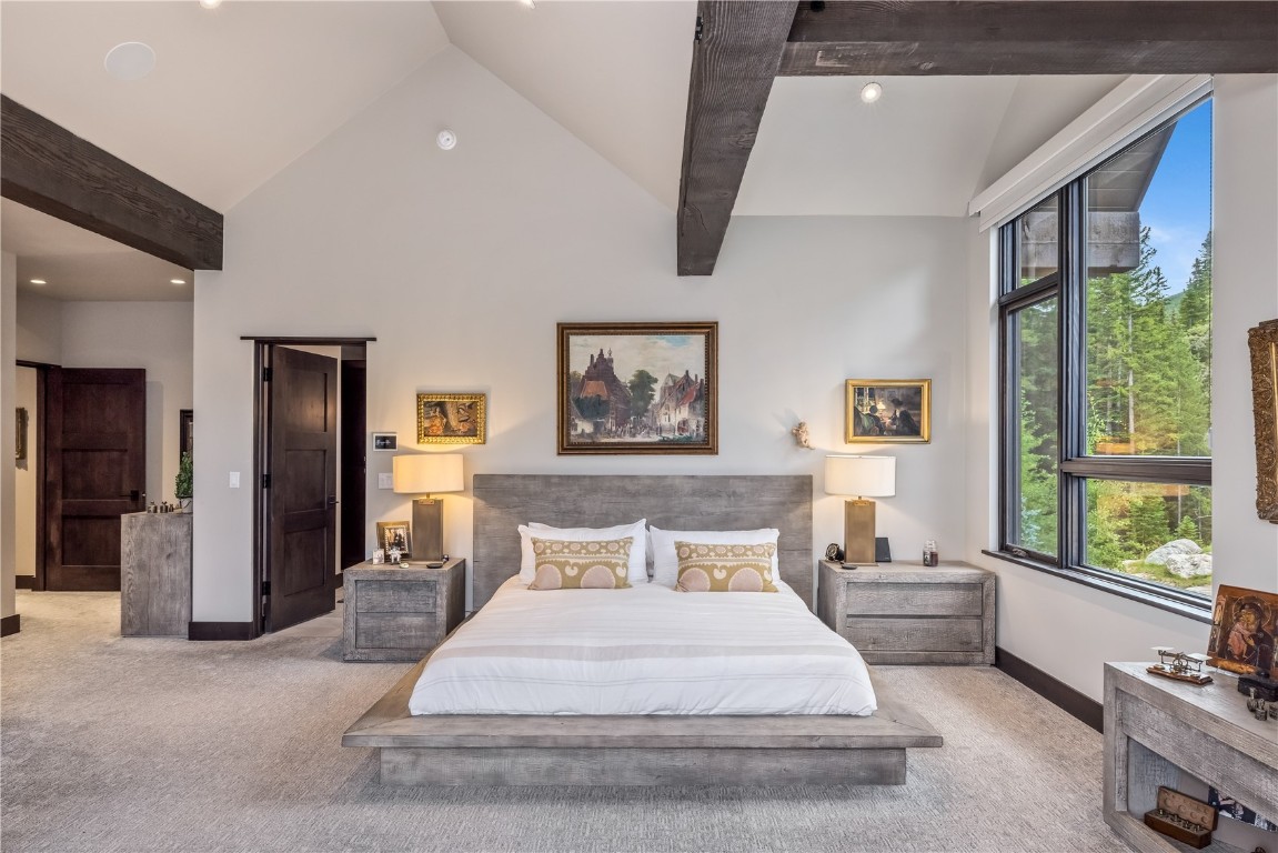 380 River Park Drive Breckenridge, CO 80424 - Photo 13 of 45 a spacious bedroom with a bed and a large window