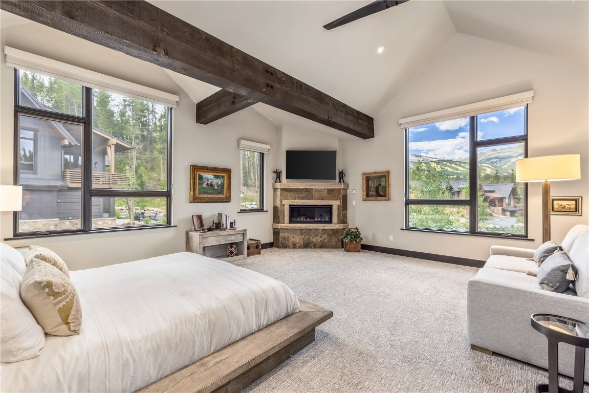380 River Park Drive Breckenridge, CO 80424 - Photo 14 of 45 a spacious bedroom with a large bed and a large window with balcony view