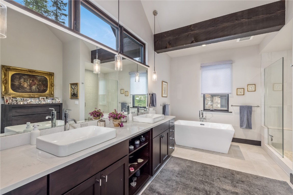 380 River Park Drive Breckenridge, CO 80424 - Photo 15 of 45 a spacious bathroom with a double vanity sink double mirror and bathtub
