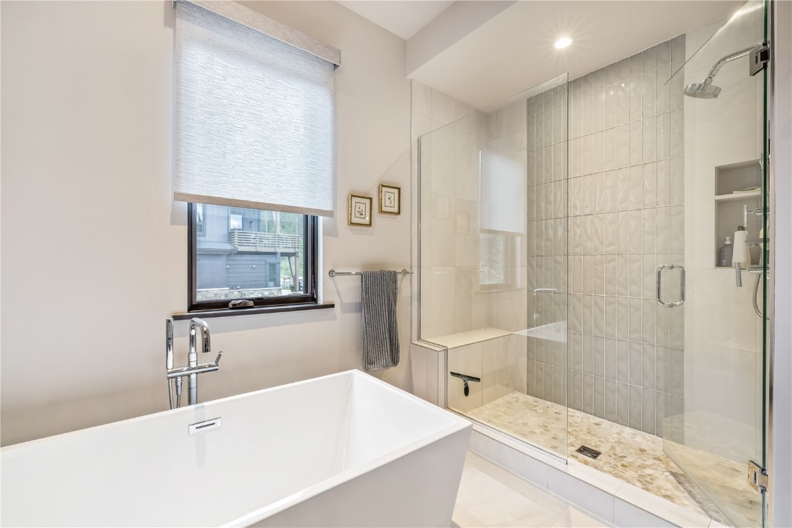 380 River Park Drive Breckenridge, CO 80424 - Photo 16 of 45 a bathroom with a tub sink shower and mirror