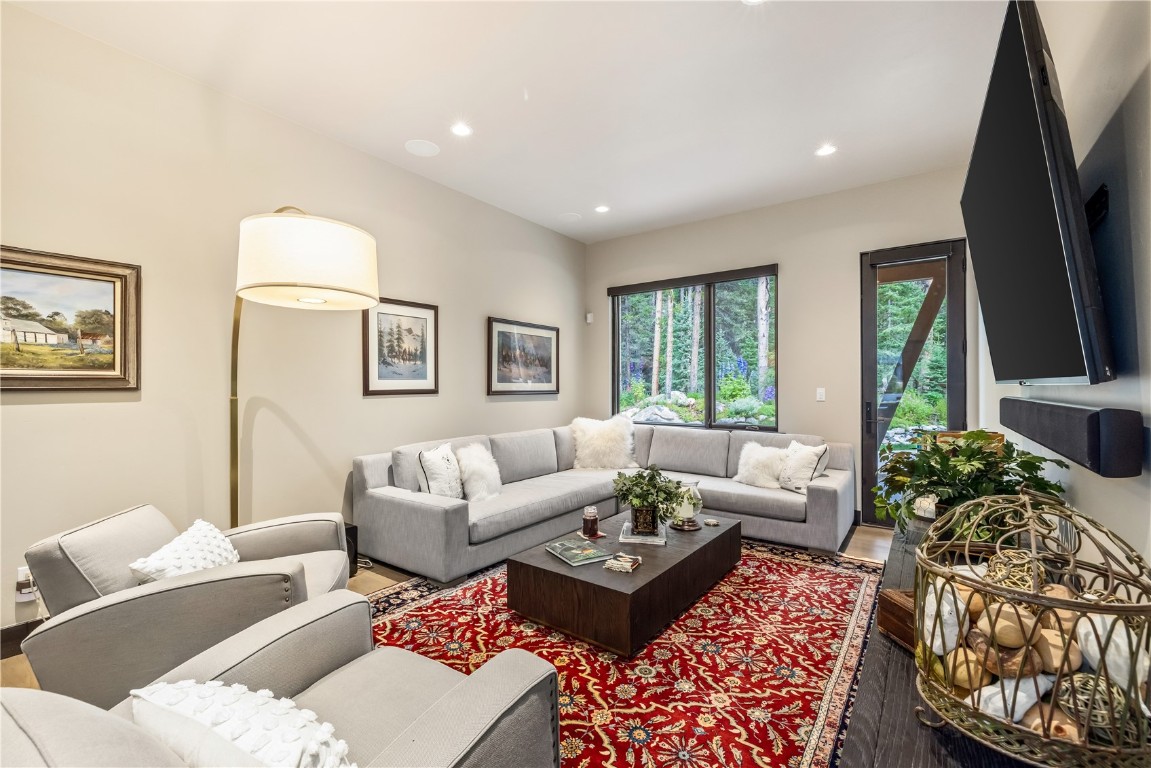 380 River Park Drive Breckenridge, CO 80424 - Photo 17 of 45 a living room with furniture flat screen tv and a large window