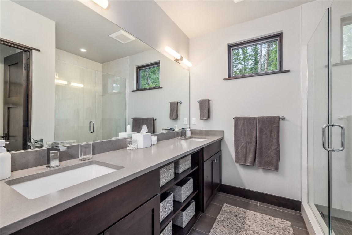 380 River Park Drive Breckenridge, CO 80424 - Photo 21 of 45 a bathroom with a sink double vanity and a mirror