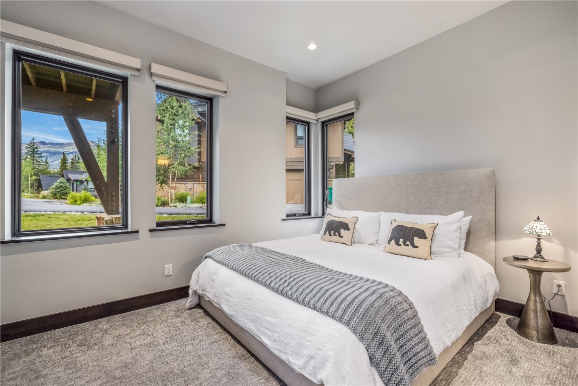380 River Park Drive Breckenridge, CO 80424 - Photo 22 of 45 a bedroom with a bed and a window