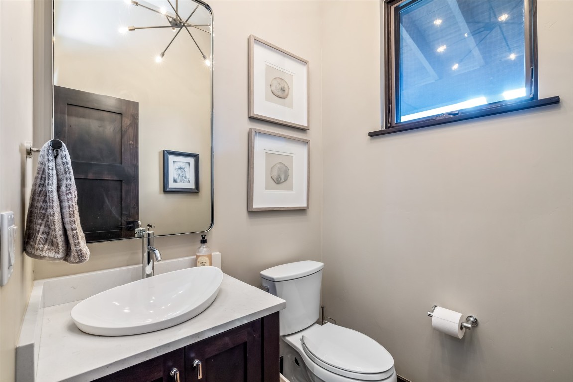 380 River Park Drive Breckenridge, CO 80424 - Photo 25 of 45 a bathroom with a toilet sink and mirror