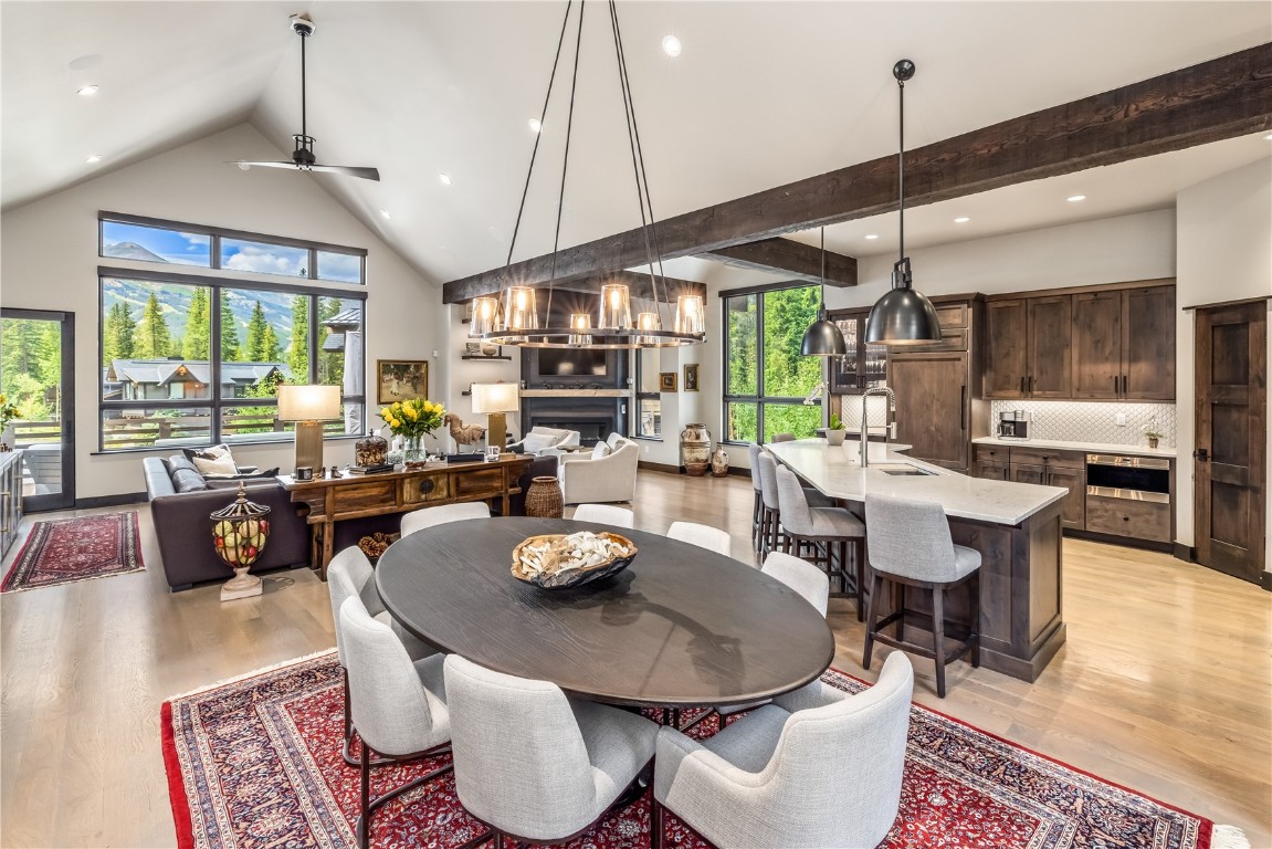 380 River Park Drive Breckenridge, CO 80424 - Photo 8 of 45 a dining room with furniture a chandelier and wooden floor