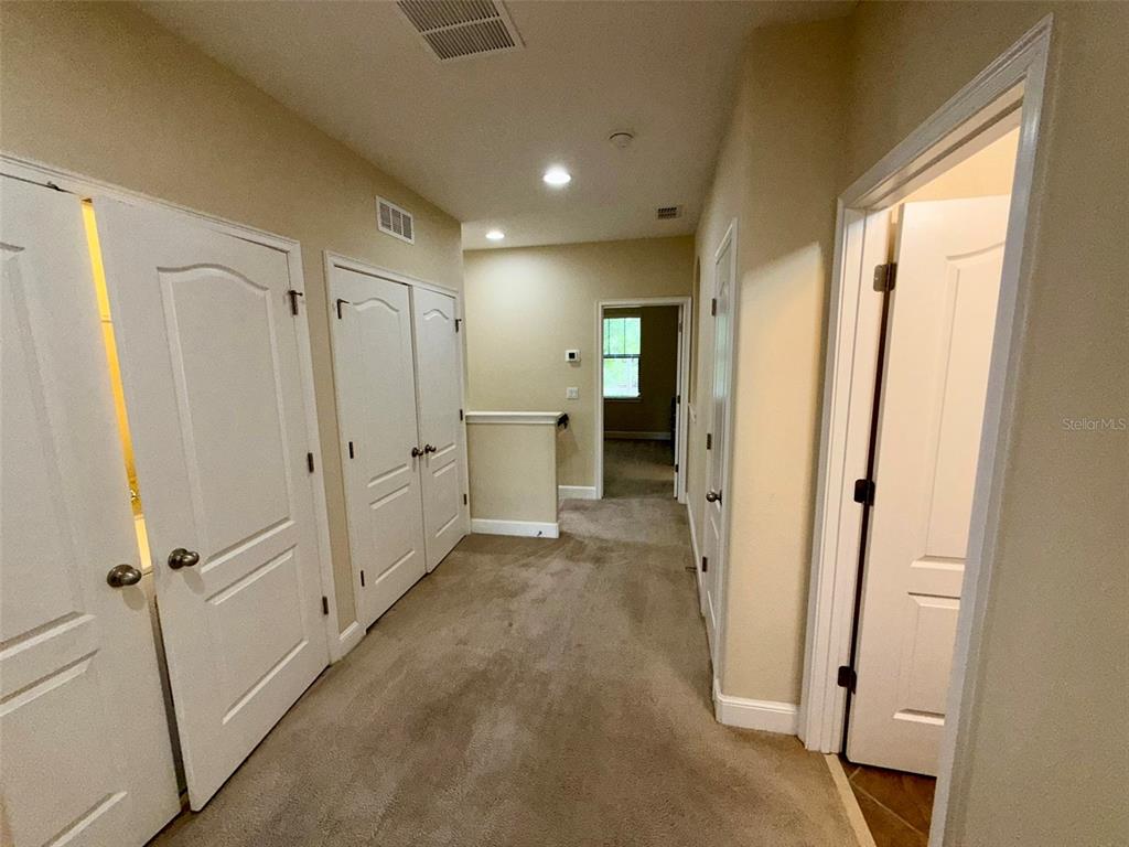 10631 Village Lake Road Windermere, FL 34786 - Photo 22 of 38 Space connecting 3 bedrooms upstairs