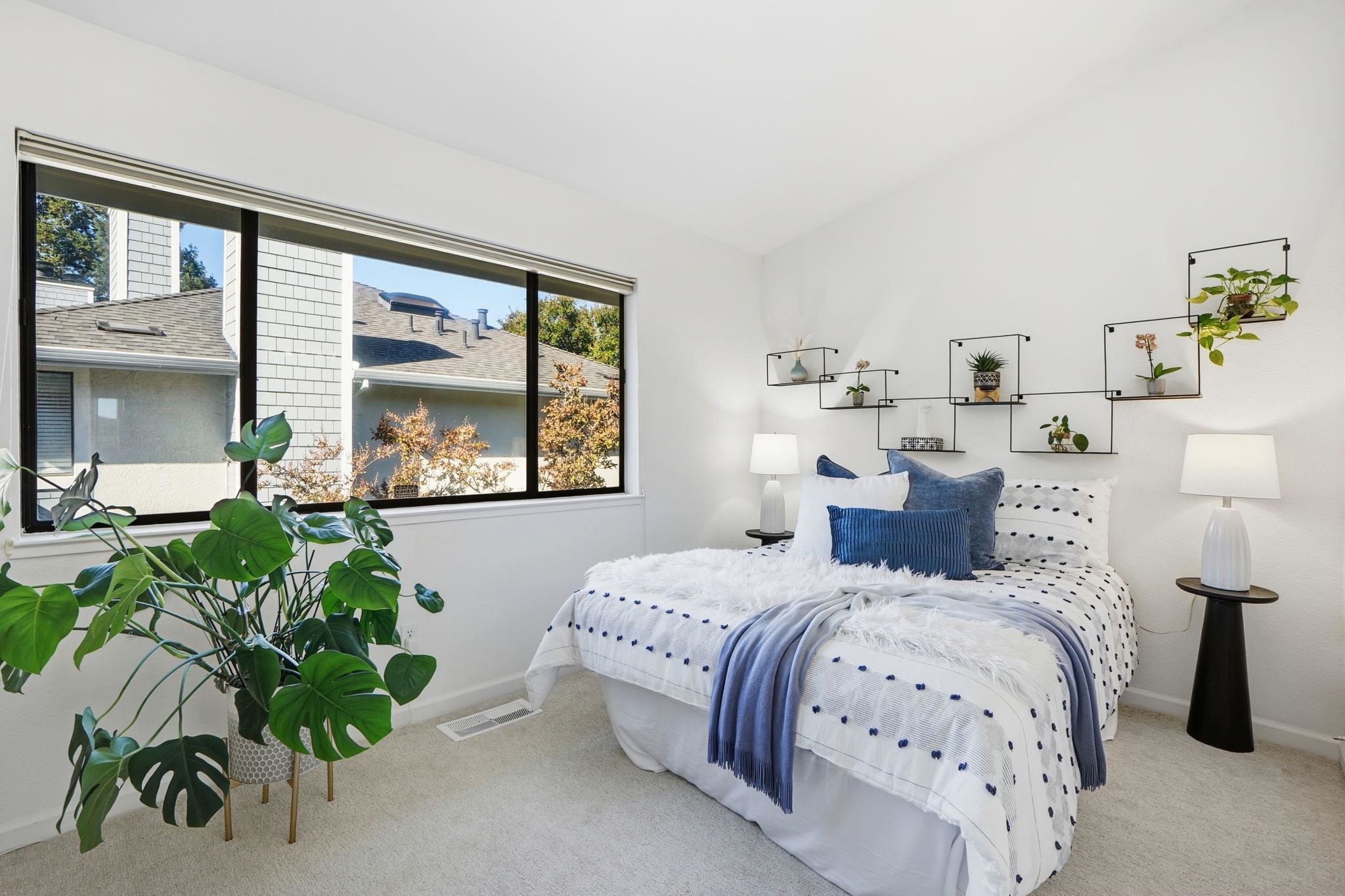 2586 Oak Road, Unit 229 Walnut Creek, CA 94597 - Photo 12 of 39 a bedroom with bed and a potted plant