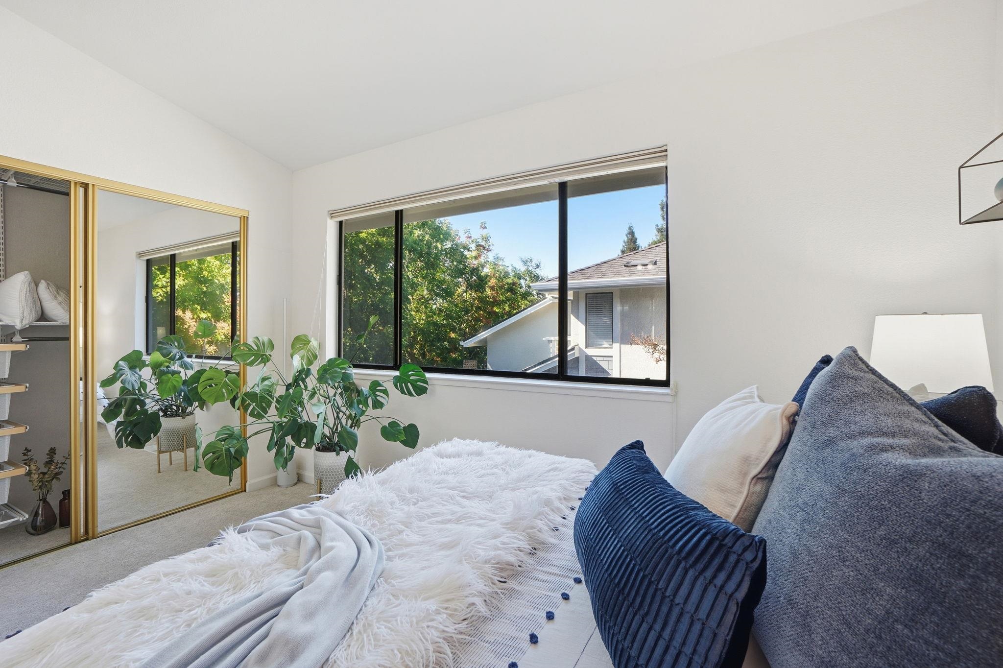 2586 Oak Road, Unit 229 Walnut Creek, CA 94597 - Photo 15 of 39 a bed sitting in a bedroom next to a window