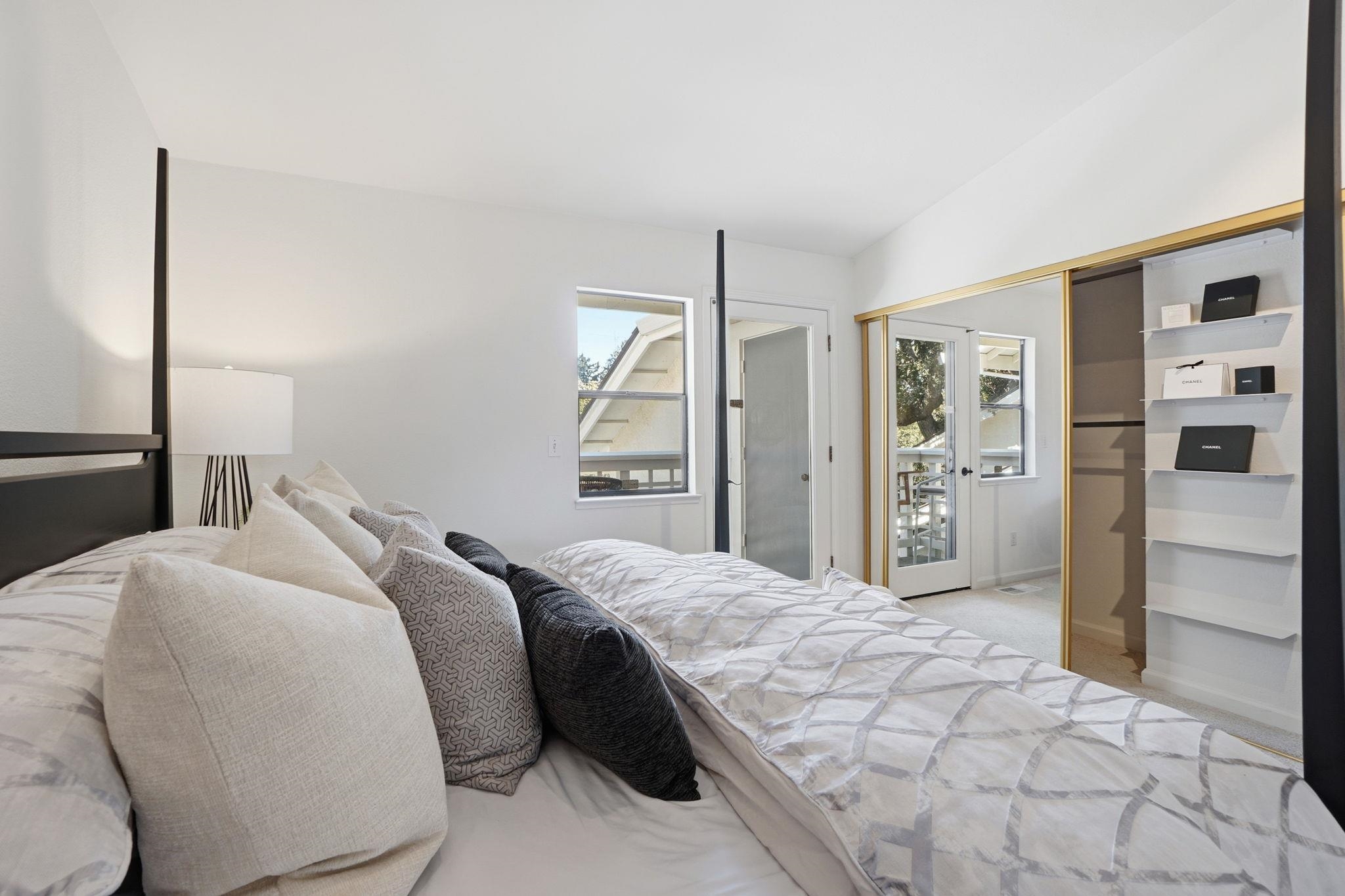 2586 Oak Road, Unit 229 Walnut Creek, CA 94597 - Photo 18 of 39 a spacious bedroom with a bed and closet