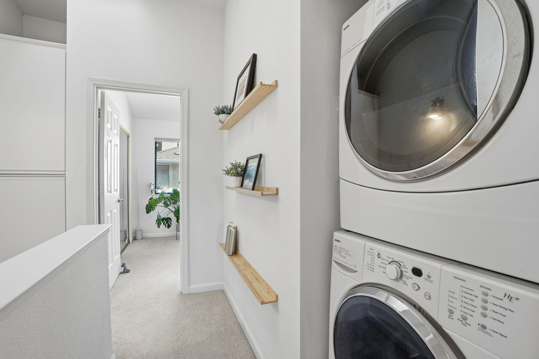 2586 Oak Road, Unit 229 Walnut Creek, CA 94597 - Photo 27 of 39 a view of a hallway with washer and dryer
