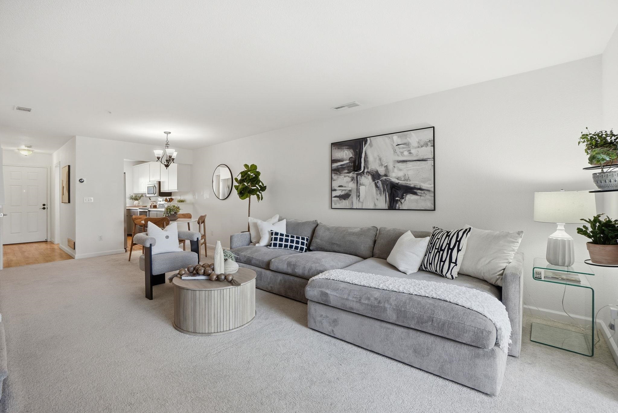 2586 Oak Road, Unit 229 Walnut Creek, CA 94597 - Photo 4 of 39 a living room with furniture and a couch