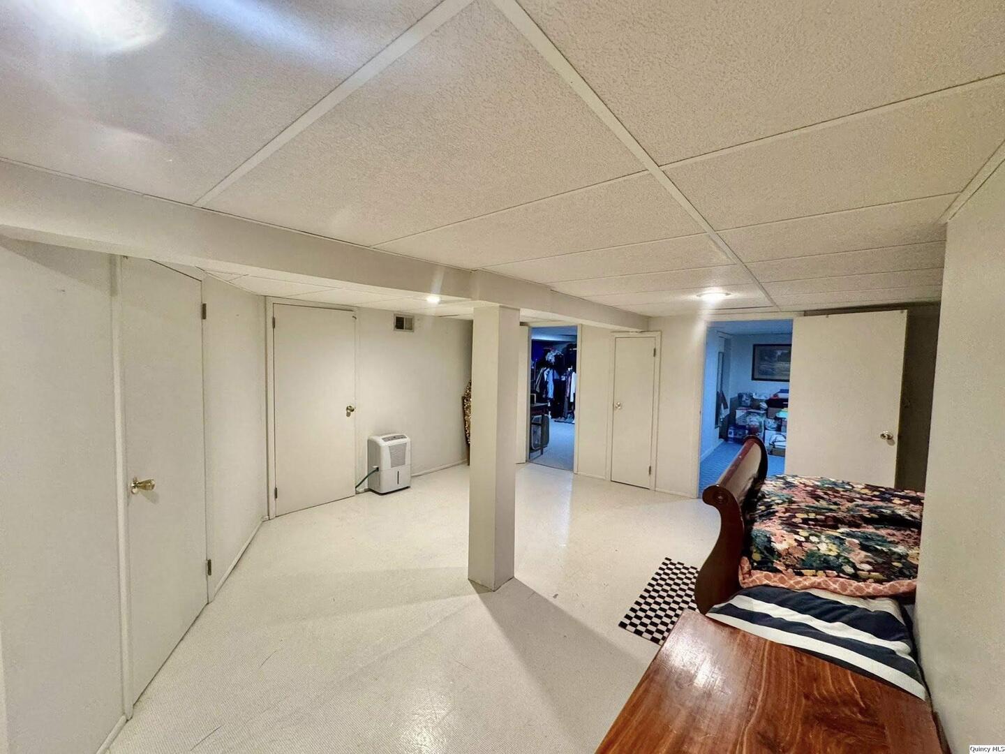 423 North 14th Street Quincy, IL 62301 - Photo 15 of 21 a very nice looking room with a bed and a mirror
