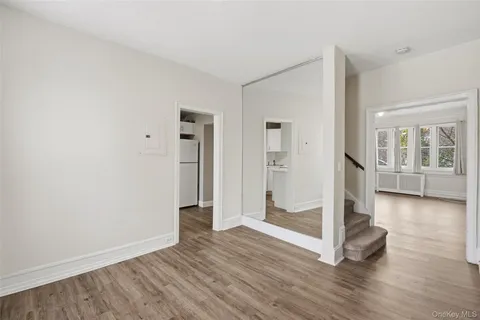 a kitchen with cabinets appliances a sink and a window