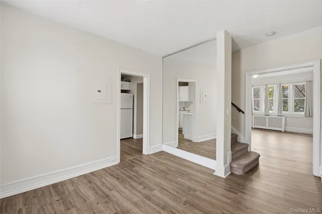 a kitchen with cabinets appliances a sink and a window