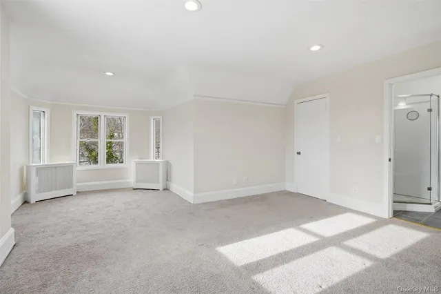 a bathroom with a sink a toilet and a shower