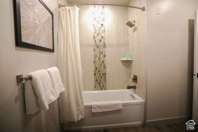 2331 Mesa Road, Unit E3 Moab, UT 84532 - Photo 28 of 71 Bathroom with shower / bath combination with curtain and dark wood-style flooring