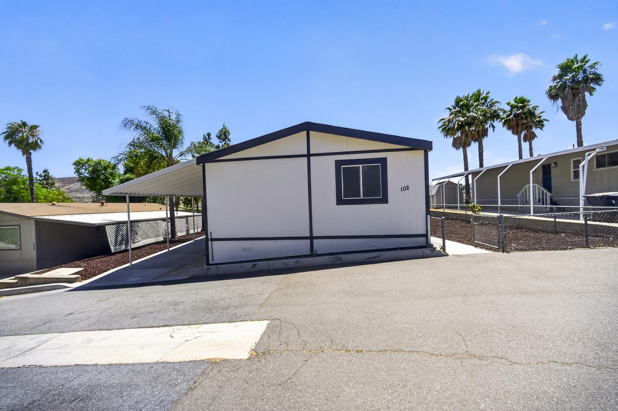 15181 Van Buren Boulevard, Unit 102 Riverside, CA 92504 - Photo 3 of 29 a house view with a outdoor space