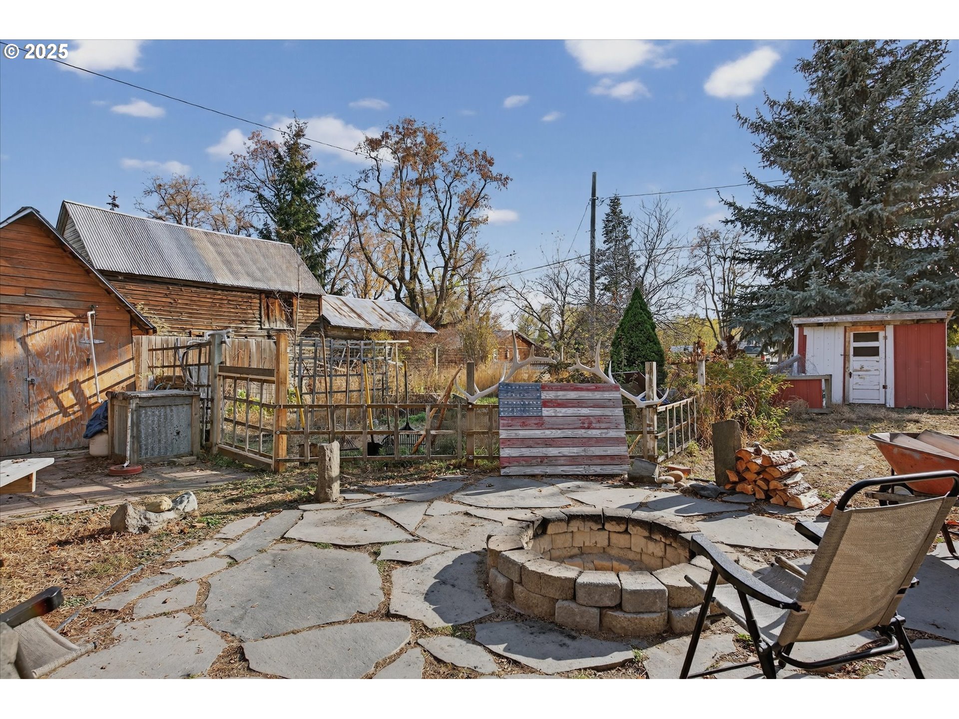 1490 10th Street Baker City, OR 97814 - Photo 11 of 24 a view of a chairs and table in backyard