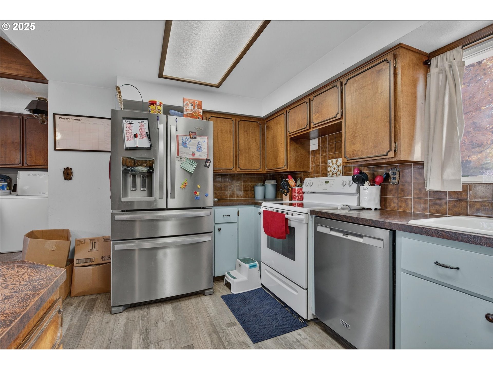 1490 10th Street Baker City, OR 97814 - Photo 17 of 24 a kitchen with a refrigerator and a sink