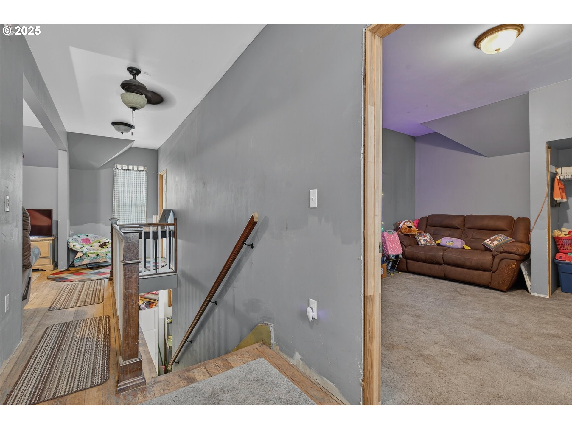 1490 10th Street Baker City, OR 97814 - Photo 21 of 24 a view of a livingroom with furniture hardwood floor and staircase