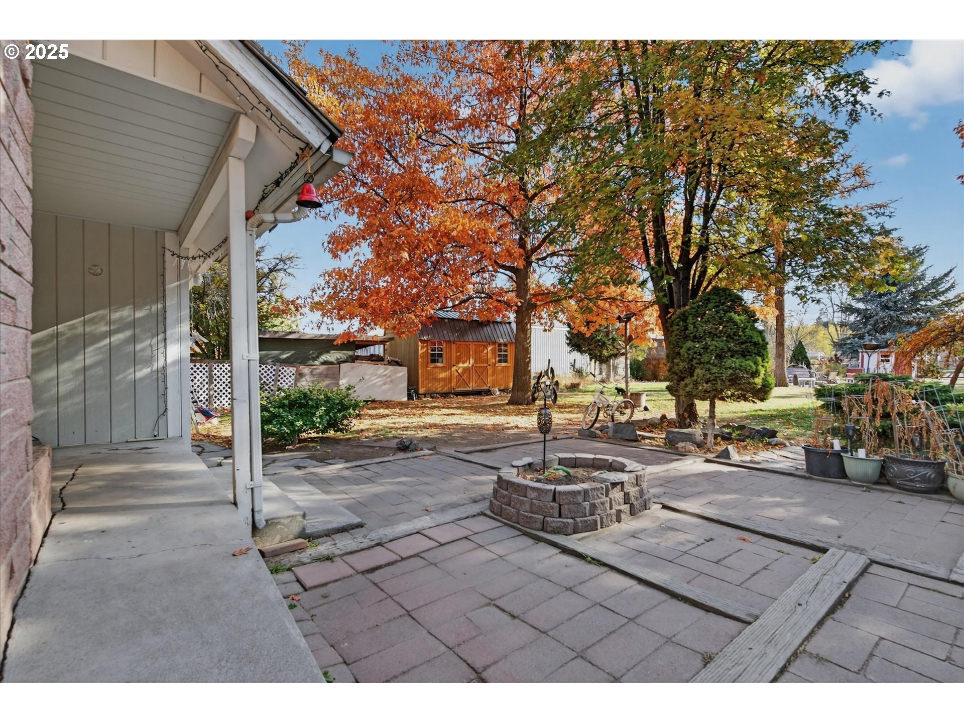 1490 10th Street Baker City, OR 97814 - Photo 8 of 24 a view of a patio with table and chairs and potted plants