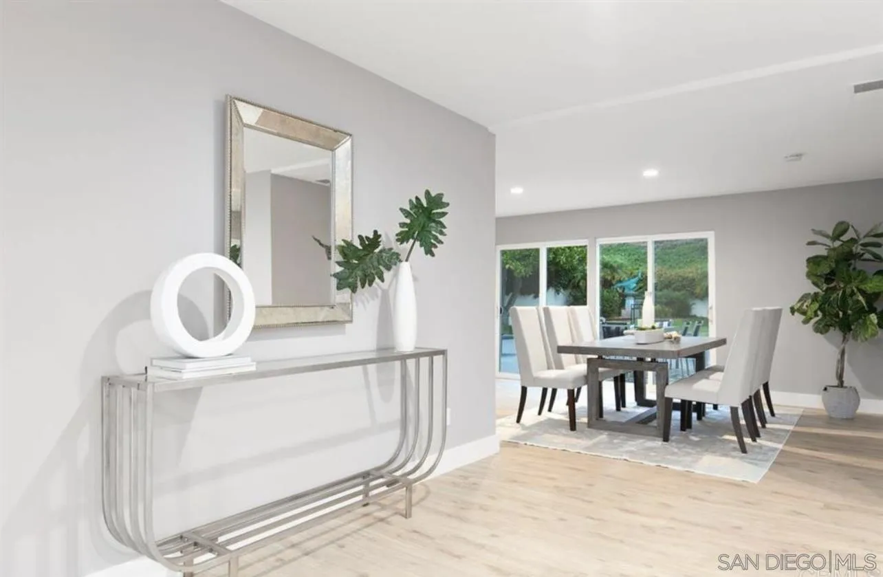 5957 Avenida Chamnez La Jolla, CA 92037 - Photo 13 of 28 a view of a dining room with furniture and a large window