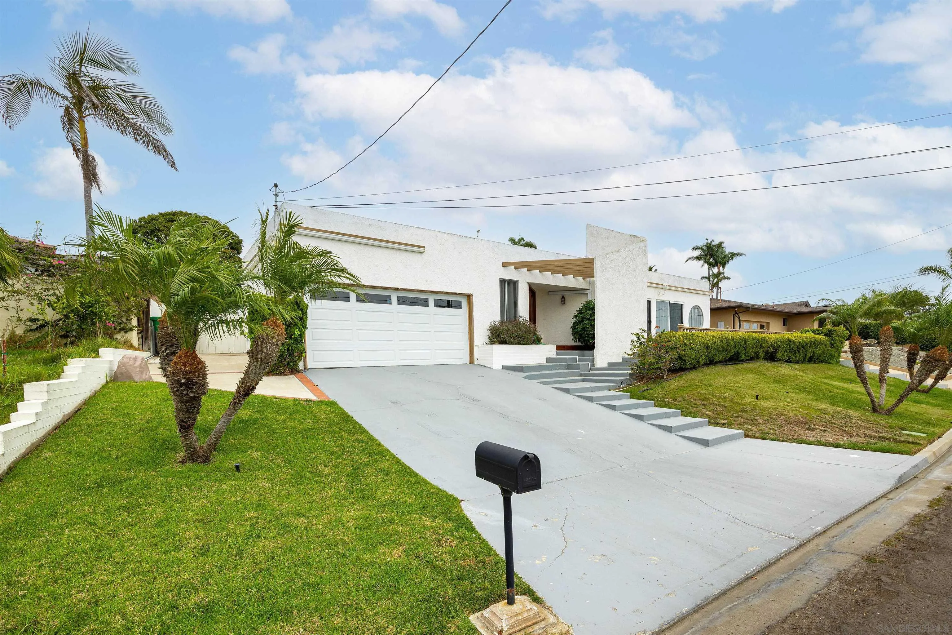 5957 Avenida Chamnez La Jolla, CA 92037 - Photo 2 of 28 a swimming pool with barbeque oven outdoor seating