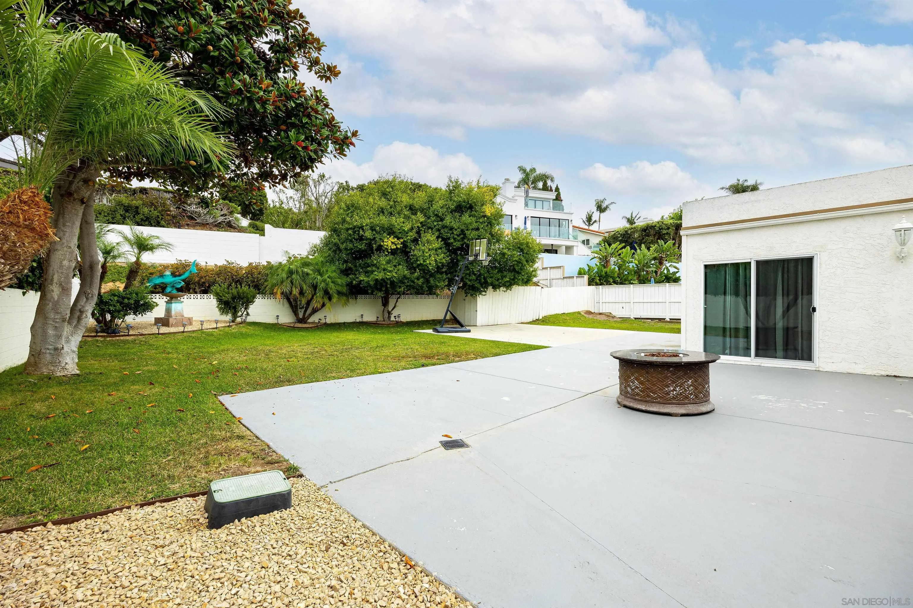 5957 Avenida Chamnez La Jolla, CA 92037 - Photo 25 of 28 a view of a swimming pool with a yard