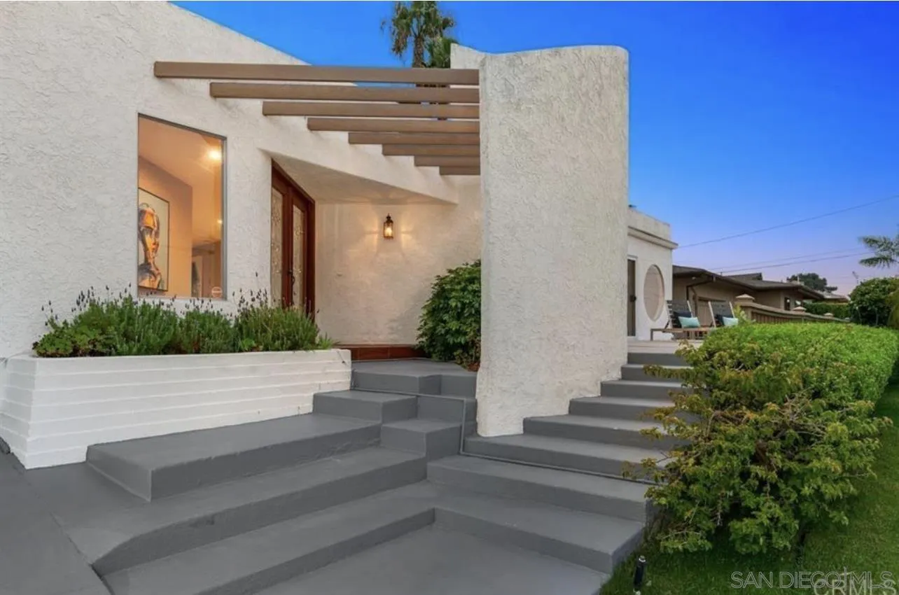 5957 Avenida Chamnez La Jolla, CA 92037 - Photo 3 of 28 a front view of a house with a yard