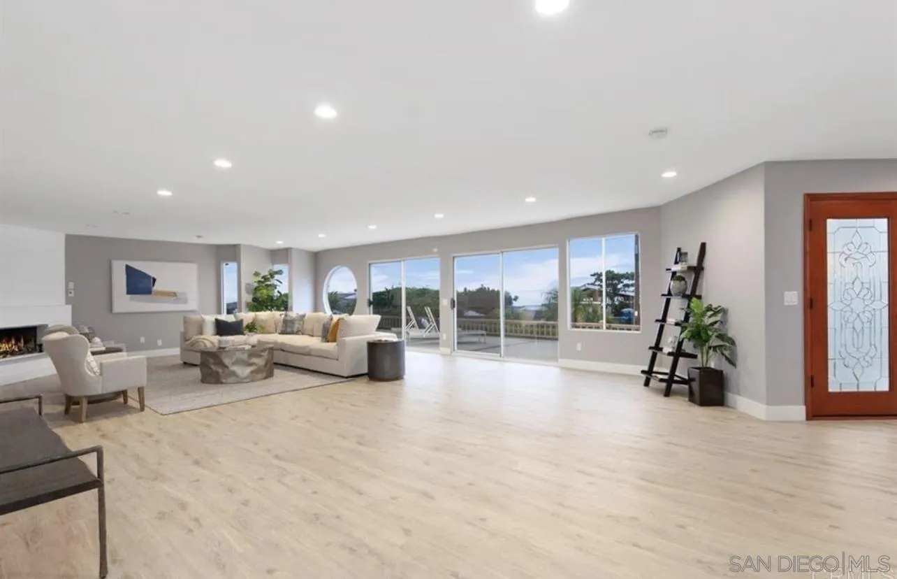 5957 Avenida Chamnez La Jolla, CA 92037 - Photo 4 of 28 a living room with furniture and large window