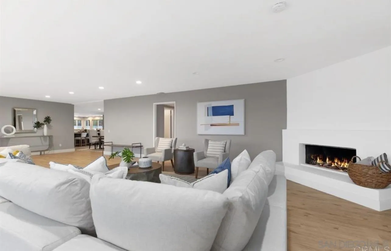 5957 Avenida Chamnez La Jolla, CA 92037 - Photo 6 of 28 a living room with furniture and a fireplace