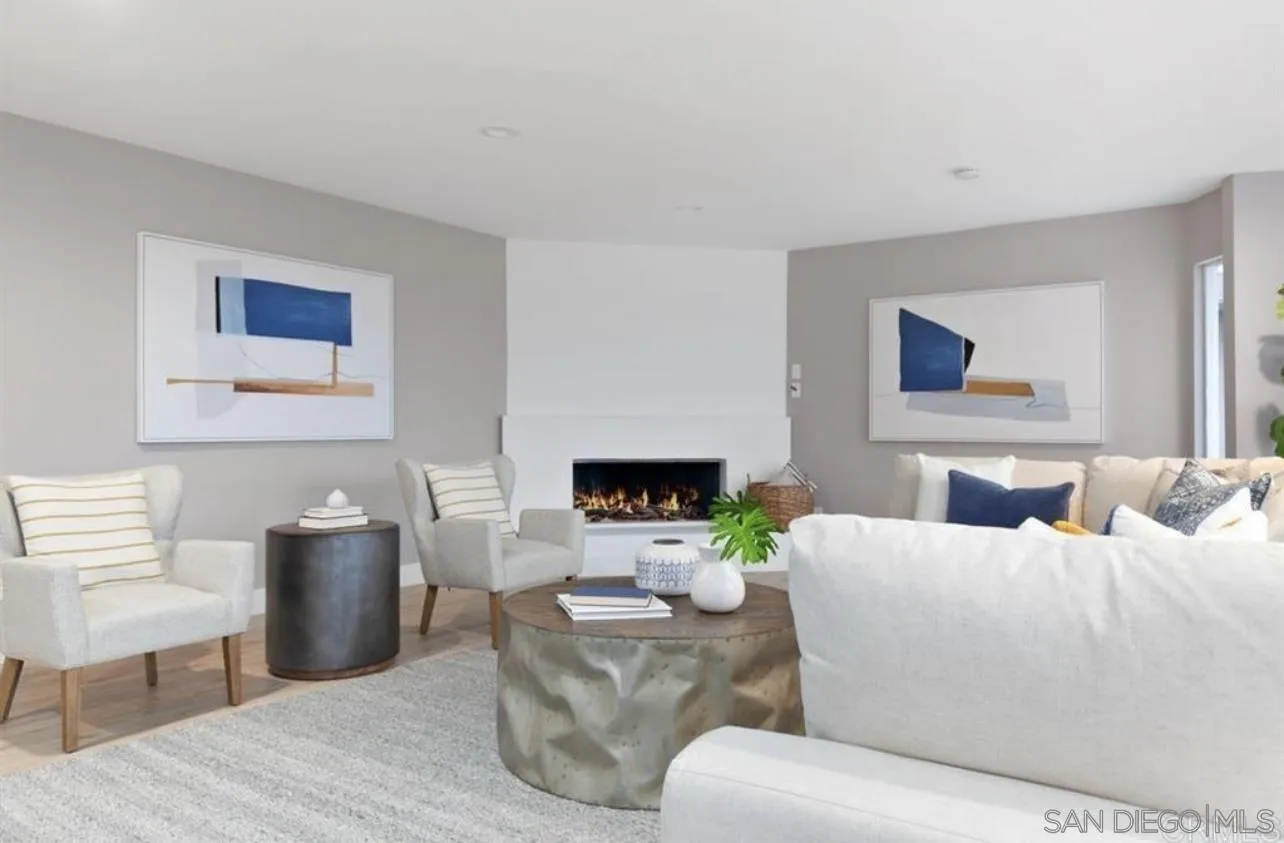 5957 Avenida Chamnez La Jolla, CA 92037 - Photo 7 of 28 a living room with furniture and a fireplace