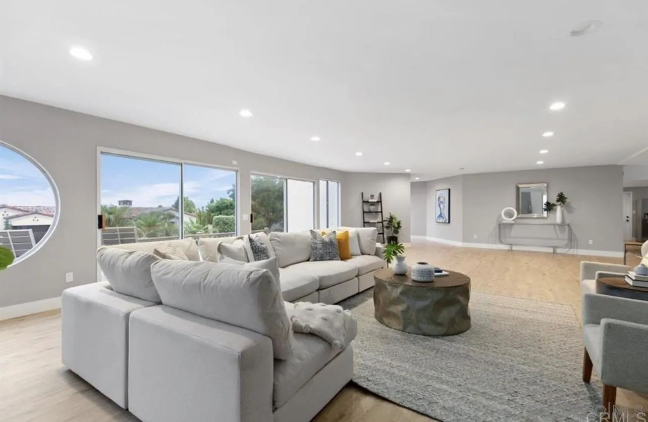 5957 Avenida Chamnez La Jolla, CA 92037 - Photo 8 of 28 a living room with furniture and a large window