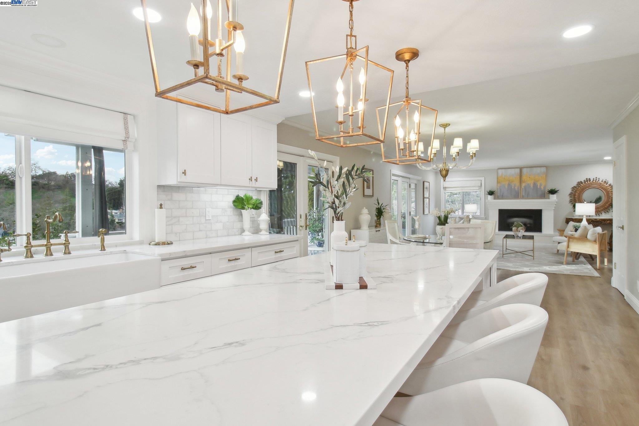 484 El Pintado Road Danville, CA 94526 - Photo 12 of 60 a spacious bathroom with a sink a large mirror and a chandelier