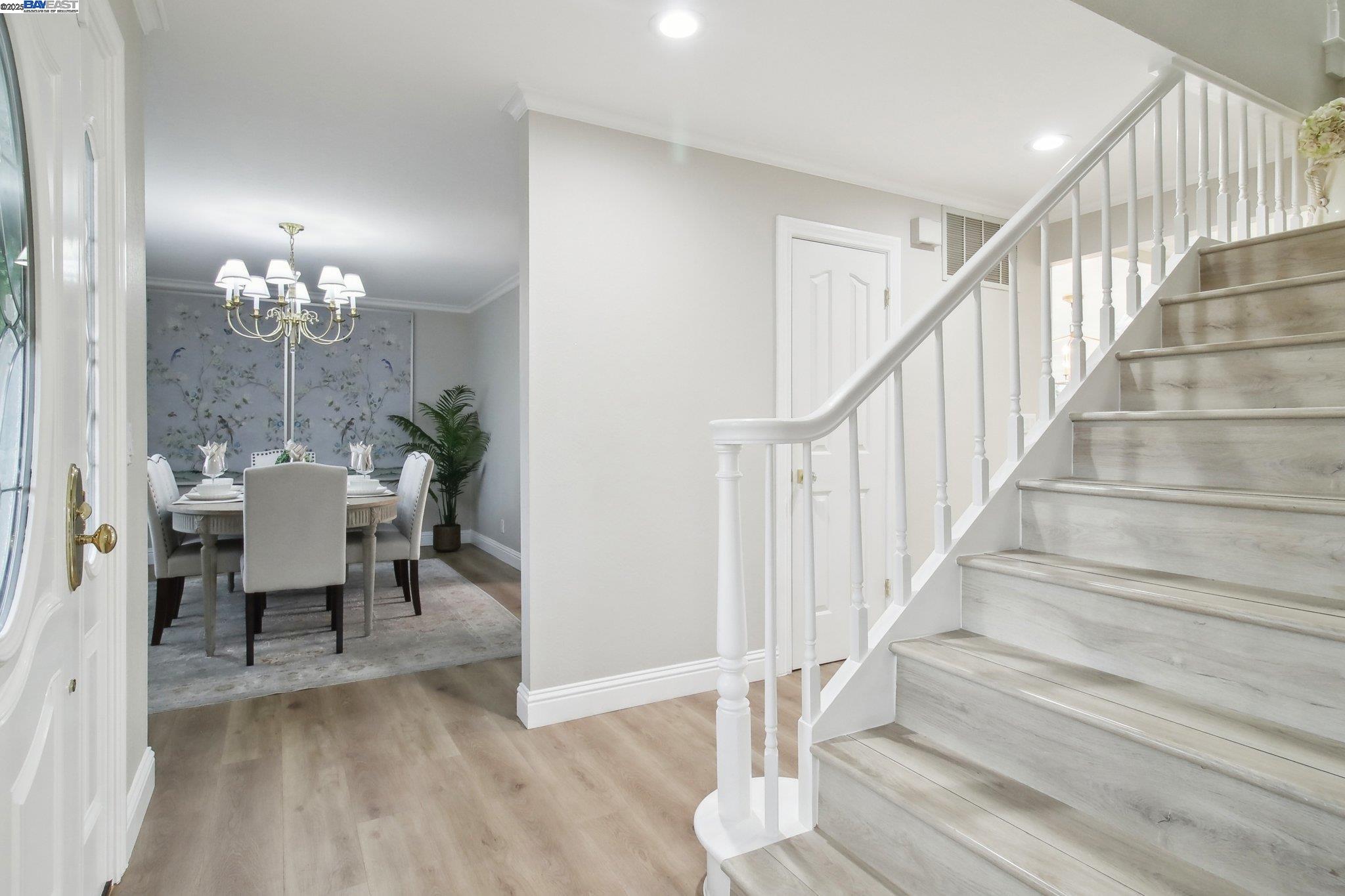 484 El Pintado Road Danville, CA 94526 - Photo 30 of 60 a view of a dining room with wooden floor and a chandelier