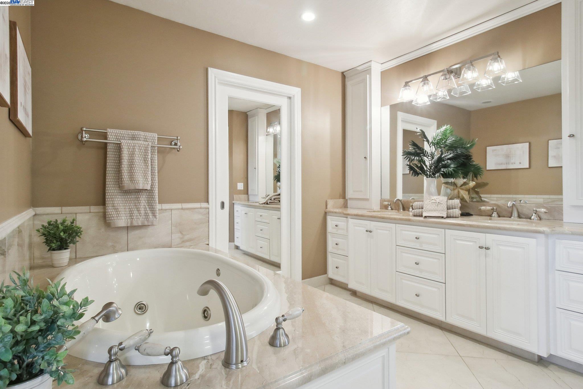 484 El Pintado Road Danville, CA 94526 - Photo 35 of 60 a spacious bathroom with a granite countertop tub sink and mirror