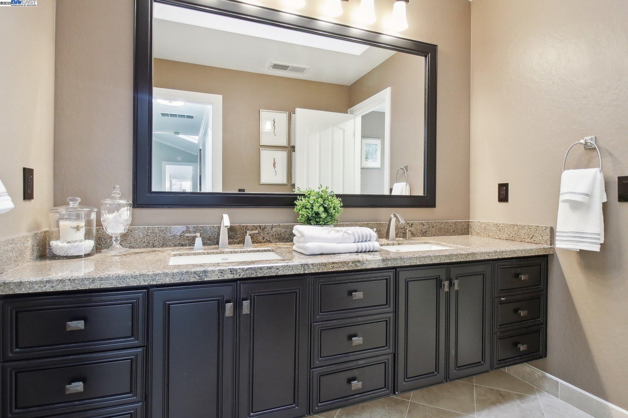 484 El Pintado Road Danville, CA 94526 - Photo 40 of 60 a bathroom with a granite countertop sink double and mirror