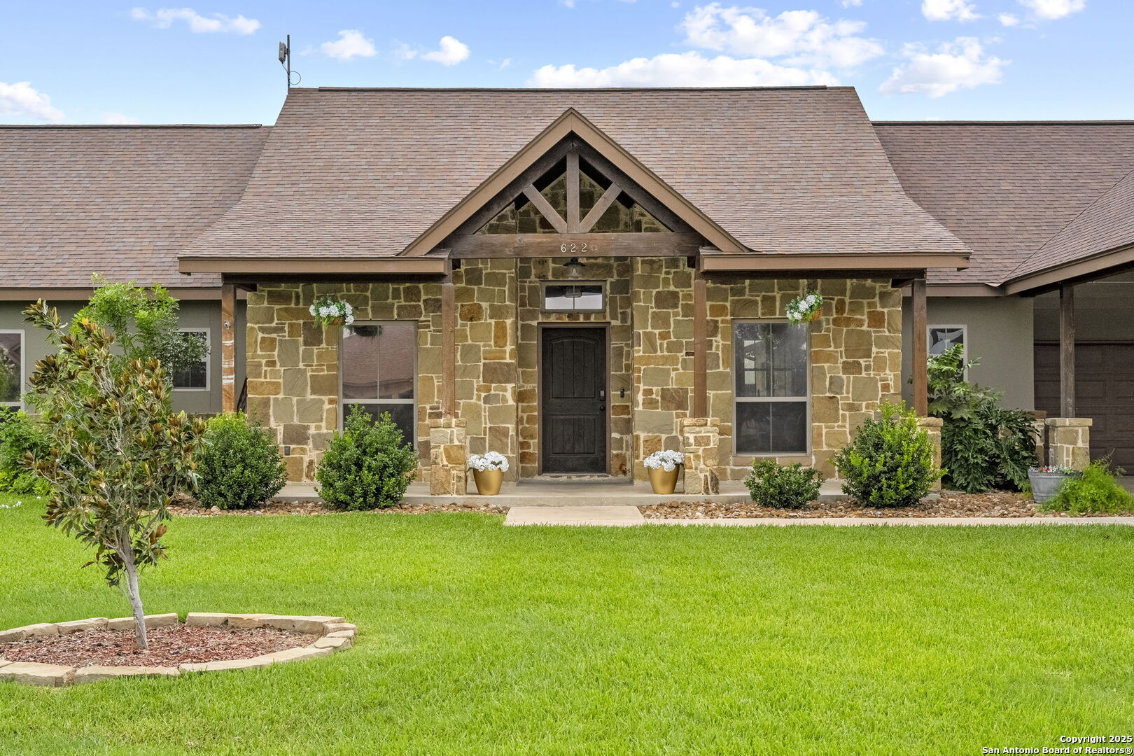 622 North Dickson Street Poth, TX 78147 - Photo 2 of 60 a front view of a house with garden and porch