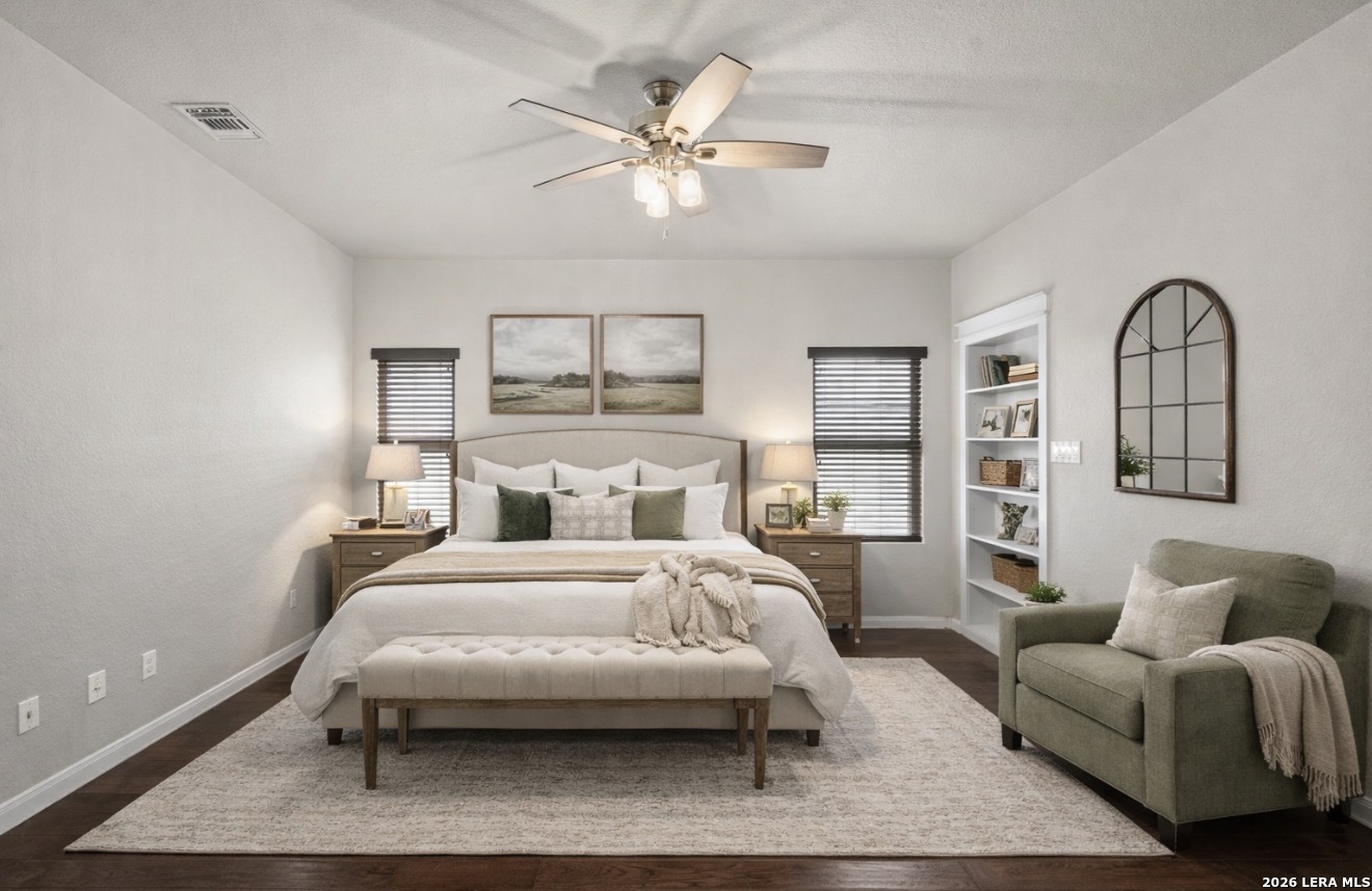 622 North Dickson Street Poth, TX 78147 - Photo 23 of 60 a bedroom with a bed couch and window