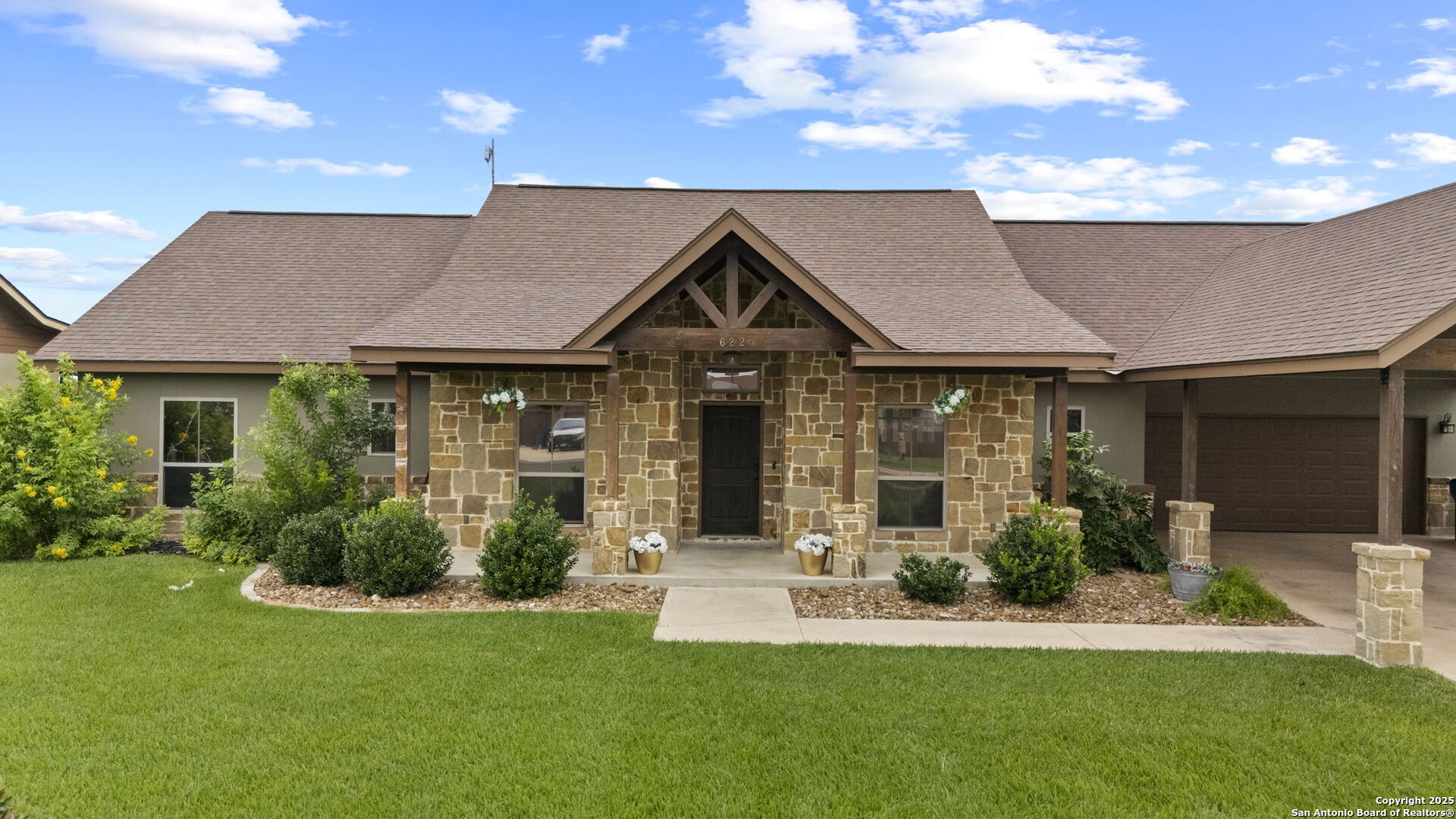 622 North Dickson Street Poth, TX 78147 - Photo 3 of 60 a front view of a house with a yard